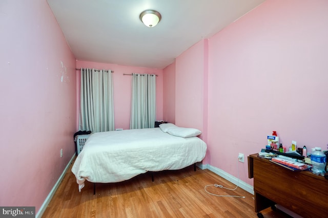 bedroom featuring wood-type flooring