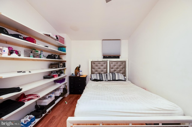 bedroom featuring dark hardwood / wood-style flooring