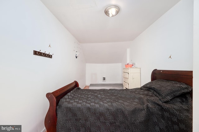 bedroom with vaulted ceiling