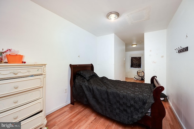 bedroom with light hardwood / wood-style flooring