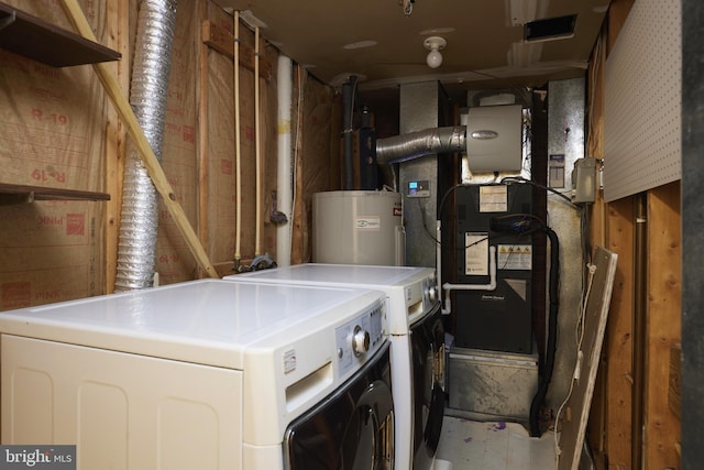 laundry area featuring washer and dryer and water heater