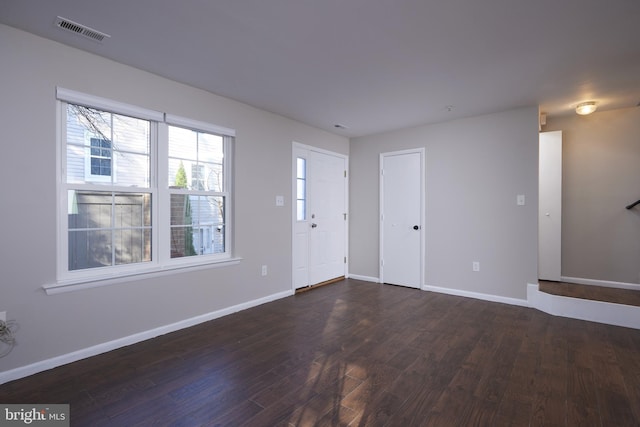 entryway with dark wood-type flooring