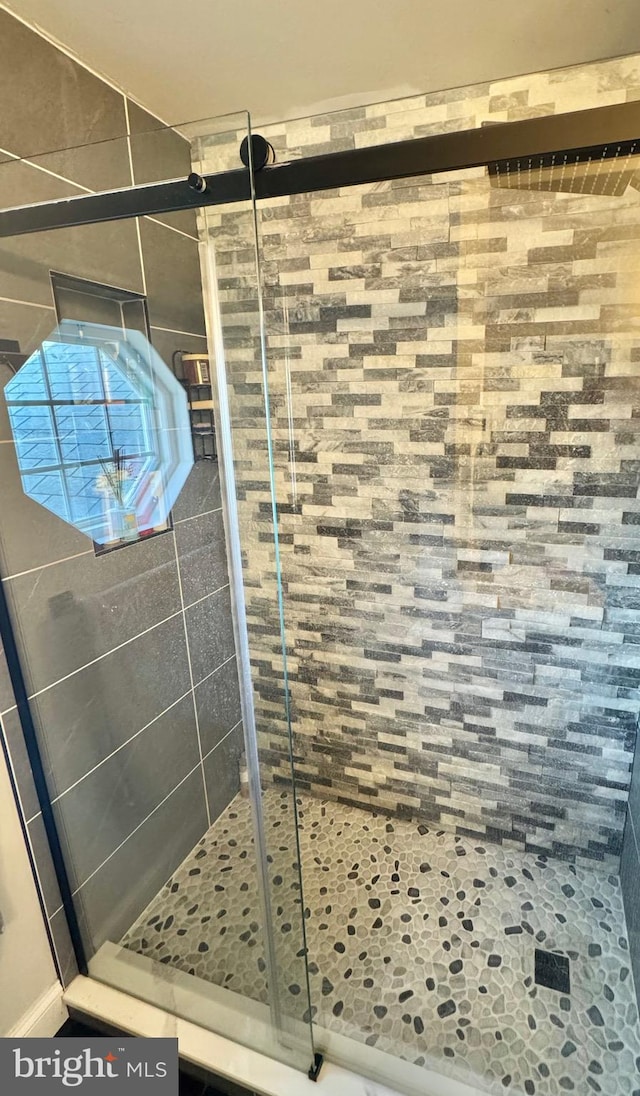 bathroom featuring walk in shower