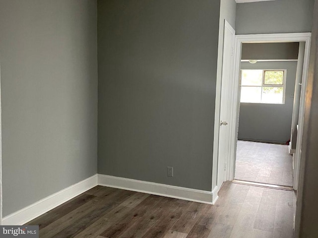 empty room with dark hardwood / wood-style floors