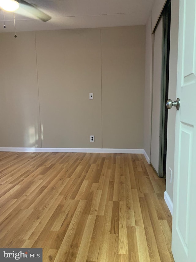 unfurnished room with ceiling fan and light hardwood / wood-style flooring