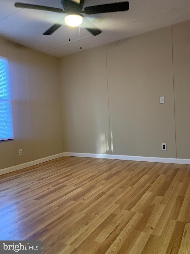 unfurnished room with light hardwood / wood-style flooring and ceiling fan