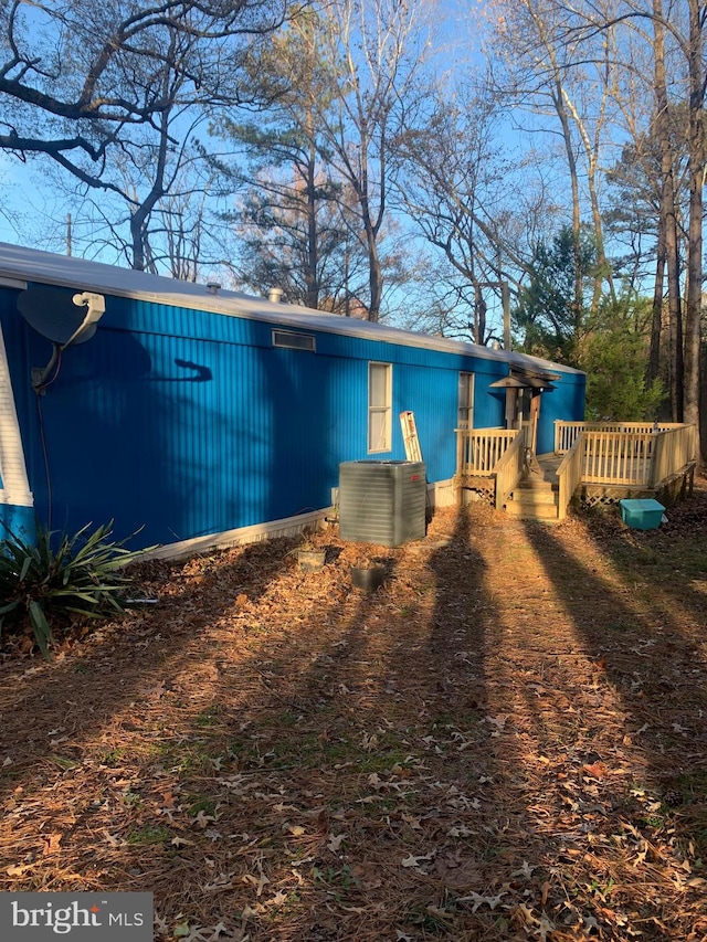 rear view of house featuring a deck