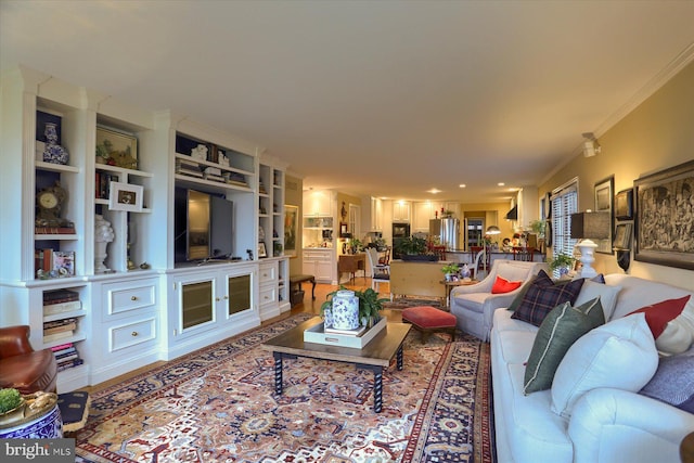 living room with ornamental molding