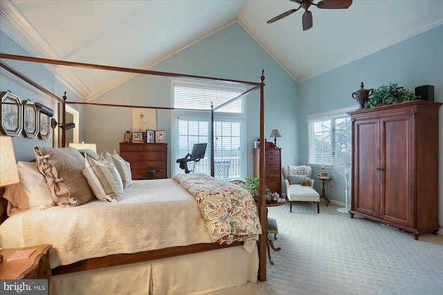 carpeted bedroom featuring ceiling fan, vaulted ceiling, and ornamental molding