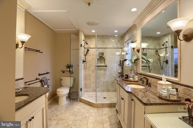 bathroom featuring tile patterned flooring, vanity, and walk in shower