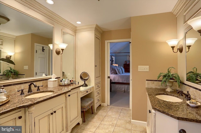 bathroom featuring tile patterned flooring and vanity