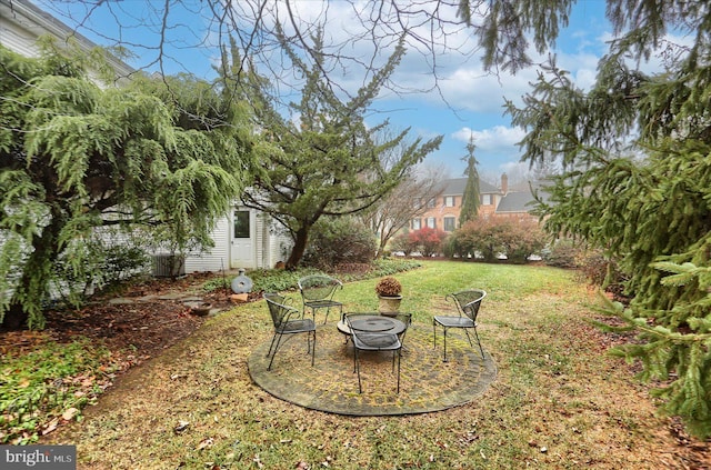 view of yard with a fire pit