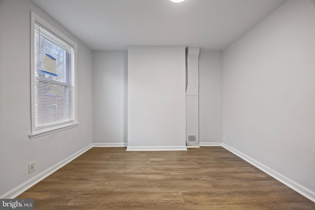 empty room featuring hardwood / wood-style flooring