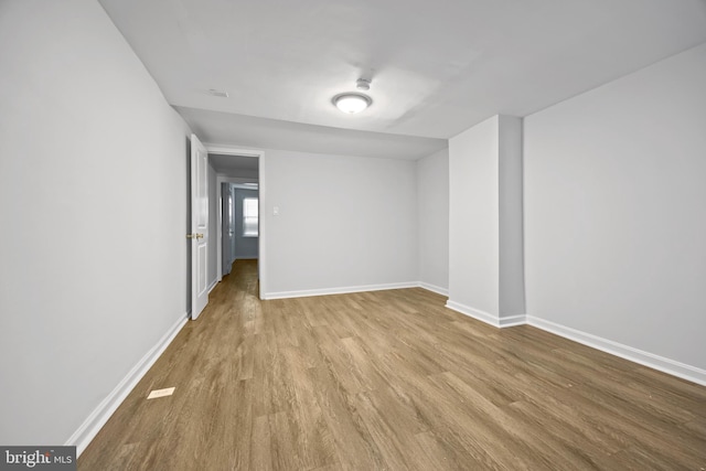 spare room with light hardwood / wood-style floors