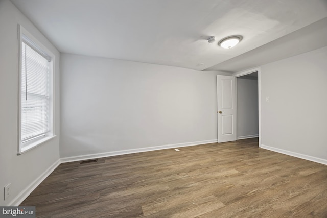 spare room with hardwood / wood-style floors