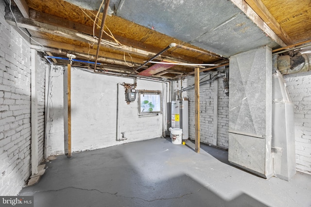 basement with gas water heater and heating unit