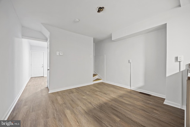 spare room with hardwood / wood-style flooring