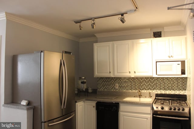 kitchen featuring backsplash, sink, white cabinets, and appliances with stainless steel finishes