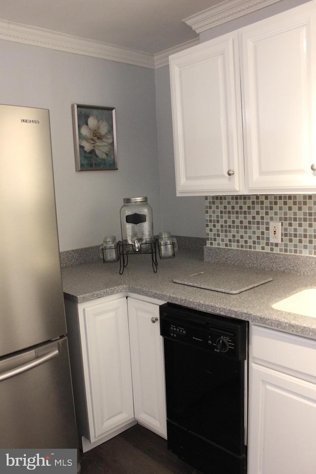 kitchen with stainless steel refrigerator, white cabinetry, crown molding, and black dishwasher