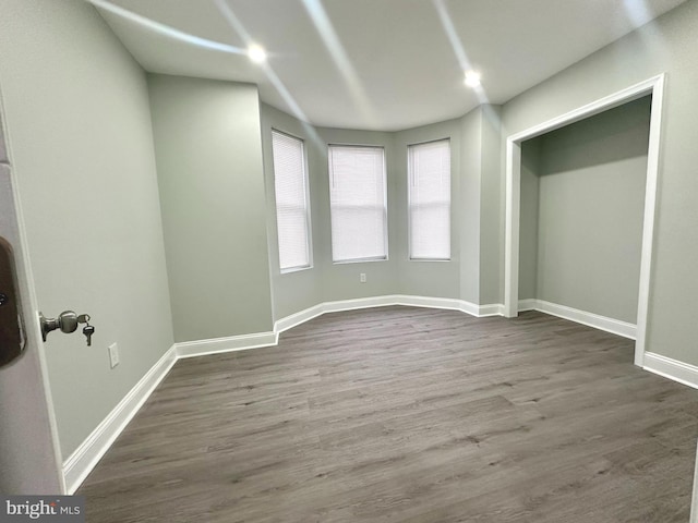 unfurnished bedroom featuring hardwood / wood-style flooring