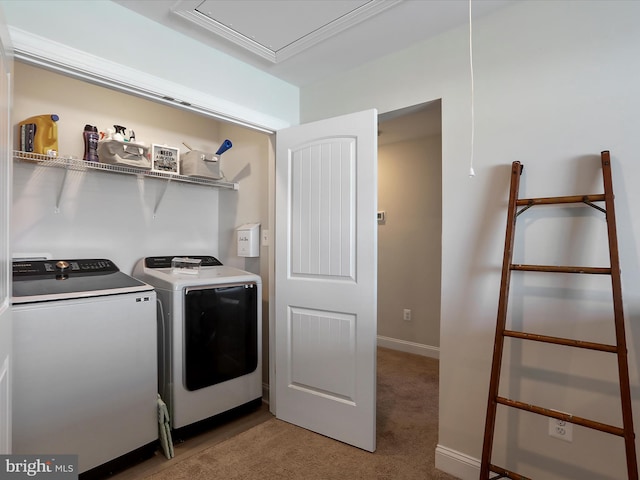 laundry area with light carpet and washing machine and dryer