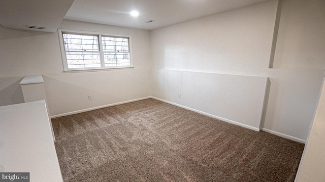 unfurnished room featuring carpet floors