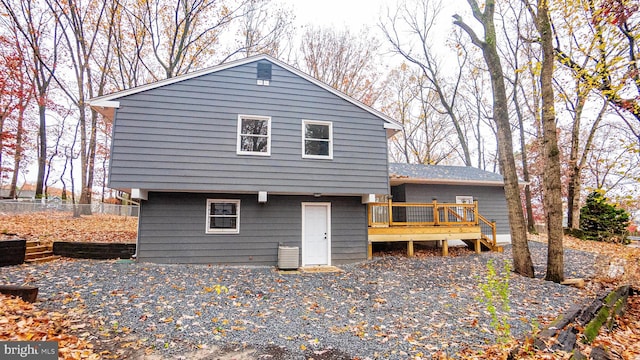 rear view of house with a wooden deck