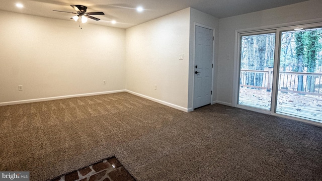 carpeted empty room featuring ceiling fan