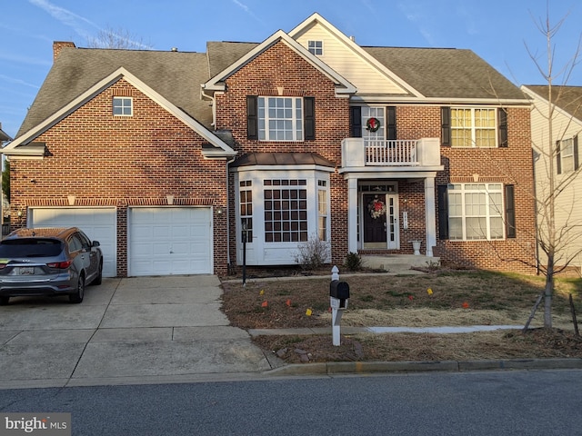 view of front of property with a garage and a balcony