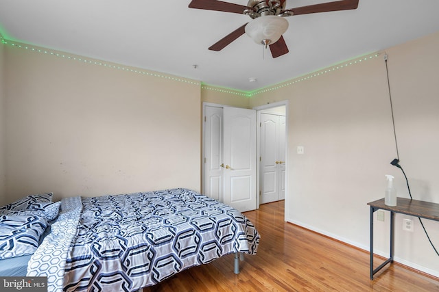 bedroom featuring hardwood / wood-style floors and ceiling fan