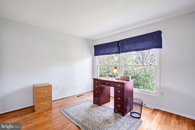 home office featuring light wood-type flooring