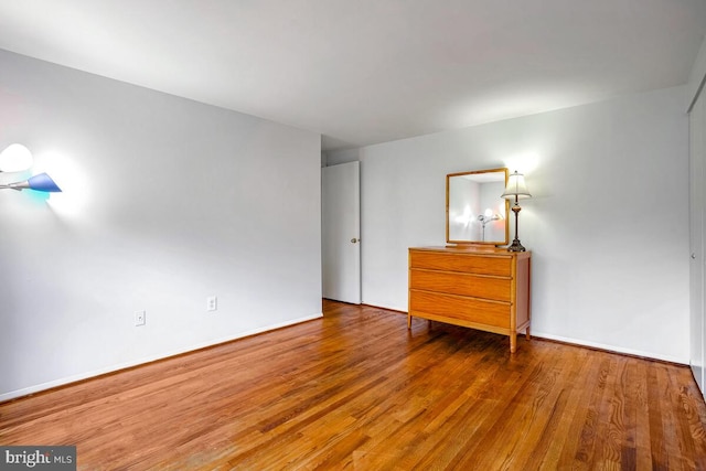 unfurnished bedroom featuring hardwood / wood-style floors