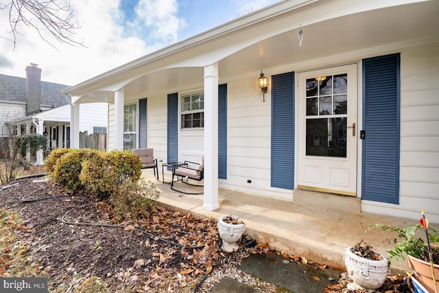 doorway to property featuring covered porch