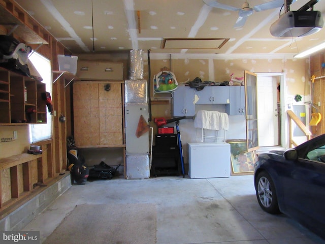 garage featuring refrigerator and a garage door opener