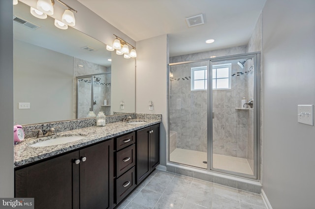 bathroom featuring walk in shower and vanity