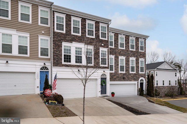 multi unit property featuring a garage