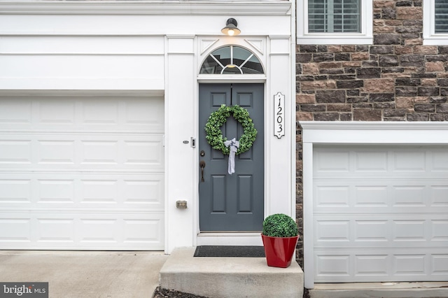 property entrance featuring a garage