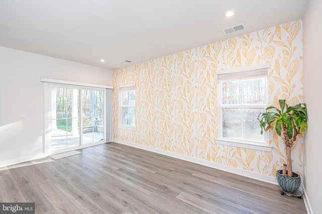 empty room with wood-type flooring