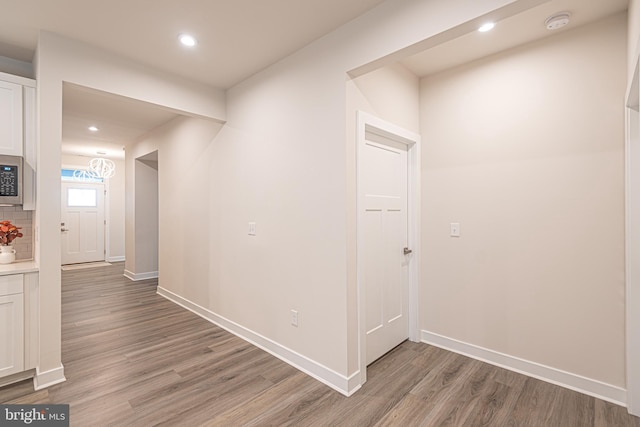 corridor featuring hardwood / wood-style floors