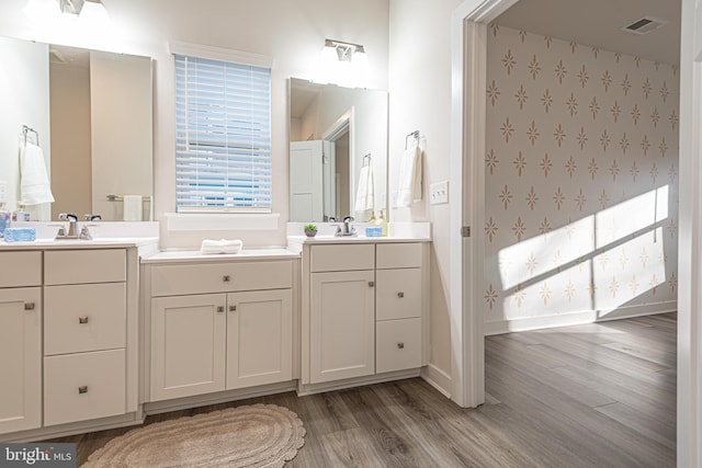 bathroom with vanity and hardwood / wood-style flooring