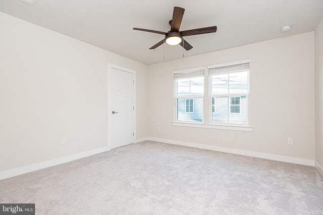 carpeted empty room with ceiling fan