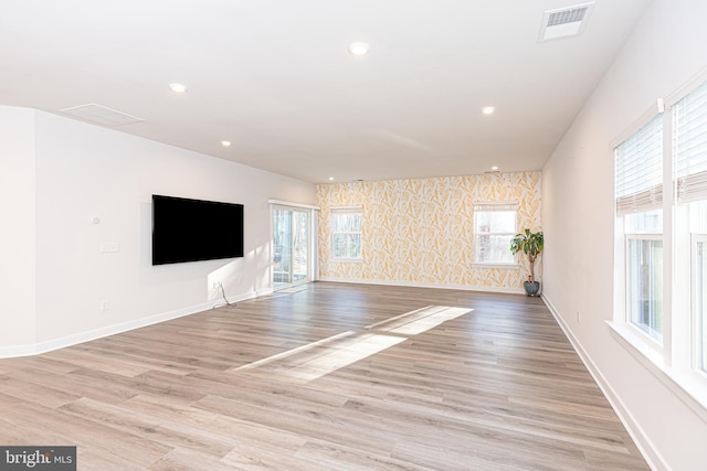 unfurnished living room featuring light hardwood / wood-style floors