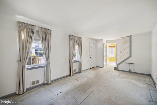 view of carpeted foyer