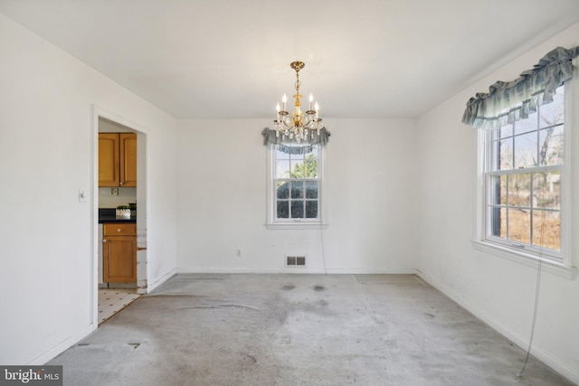 unfurnished dining area with light carpet and a notable chandelier