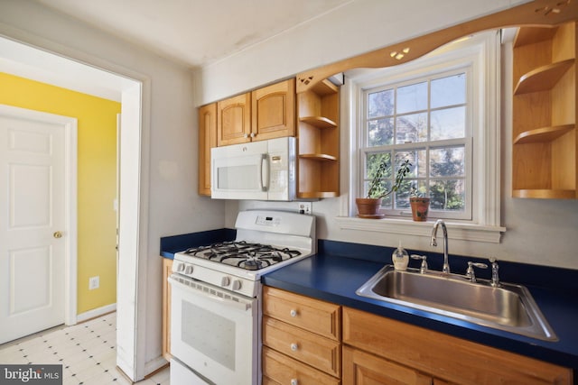 kitchen featuring sink and white appliances