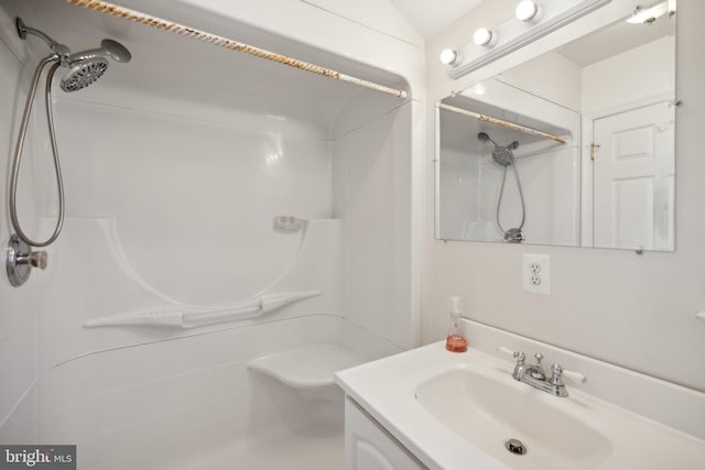 bathroom with vanity and walk in shower