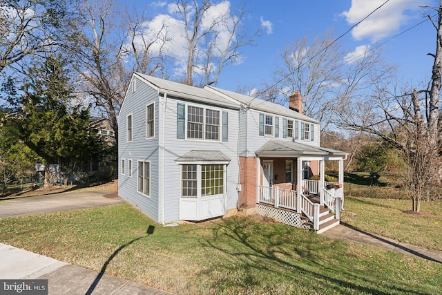 view of front of property with a front yard and a porch