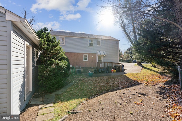 back of property featuring central AC unit and a patio