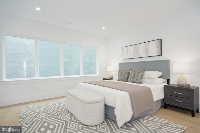 bedroom with light hardwood / wood-style floors