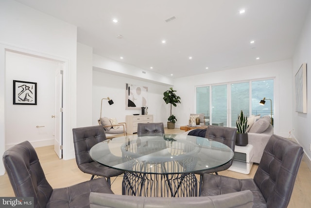 dining area with light hardwood / wood-style flooring